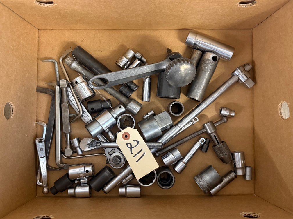 Assortment Of Socket Wrench Components And Mechanic Tools