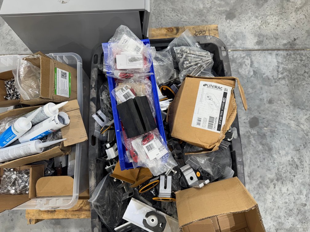 Pallet With Solar Brackets, Rails, Screws, Bolts, Durlink Sealant, Etc.