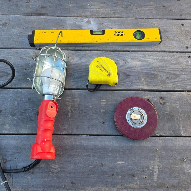 4pc Laser Level, Measuring Tapes, and Trouble Light Tool Lot