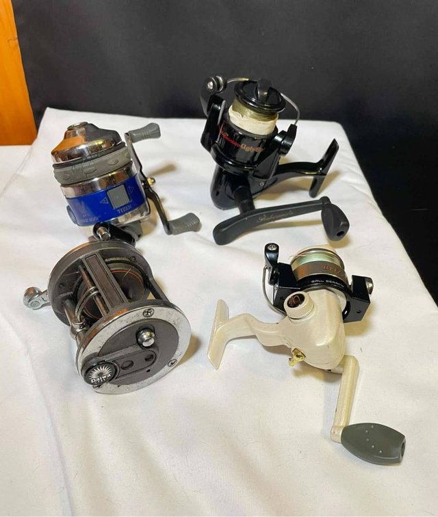 4 Fishing Reels Including Daiwa, Shakespeare