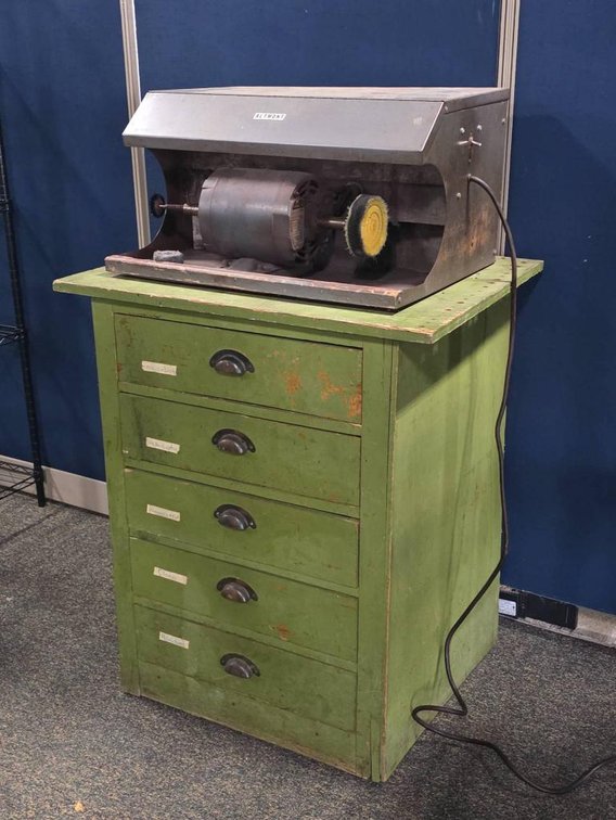 Altmont Polishing Motor on Green Wooden Cabinet with Drawers