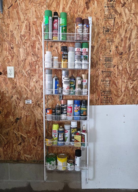 Metal Rack With Assorted Spray Paints and Finishes