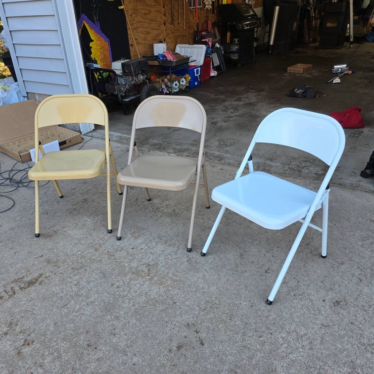 Three Metal Folding Chairs in Beige, Yellow, and White