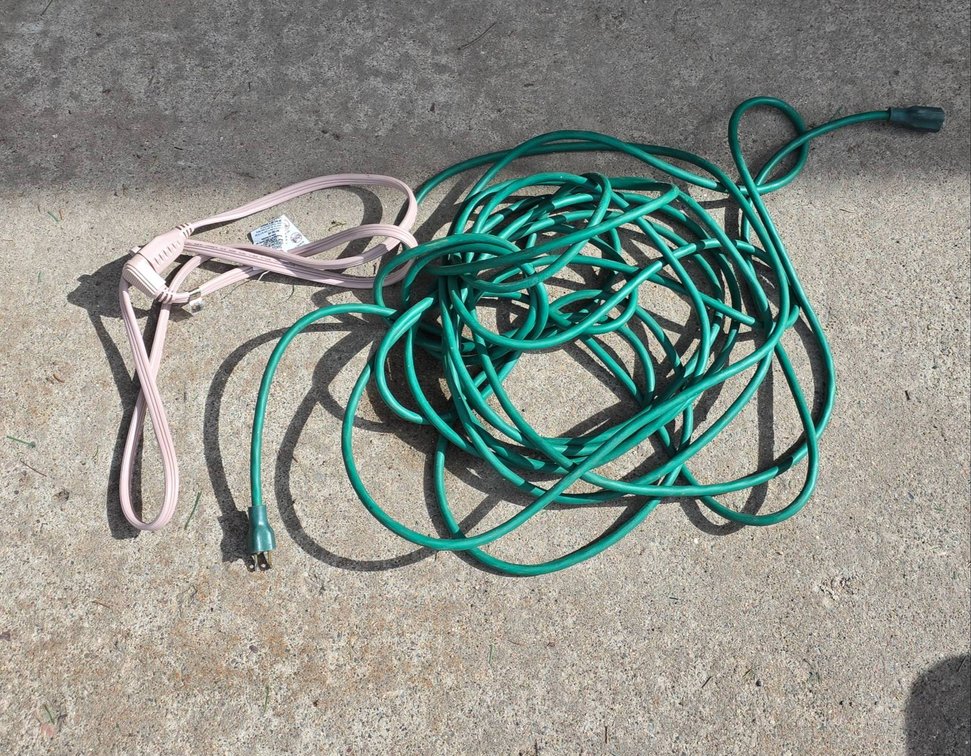 Green and Pink Extension Cords with Three-Prong Plug Ends