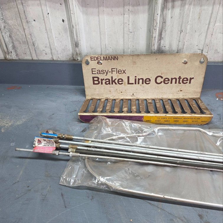 Brake Line Holder with Assorted Brake Lines and Fittings