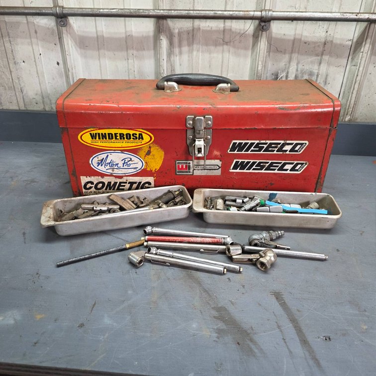 Red Metal Toolbox With Assorted Valves, Fittings, and Tools