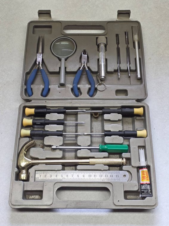 Tool Kit with Pliers, Screwdrivers, Hammer, Glue, and Cutting Tools in Plastic Case