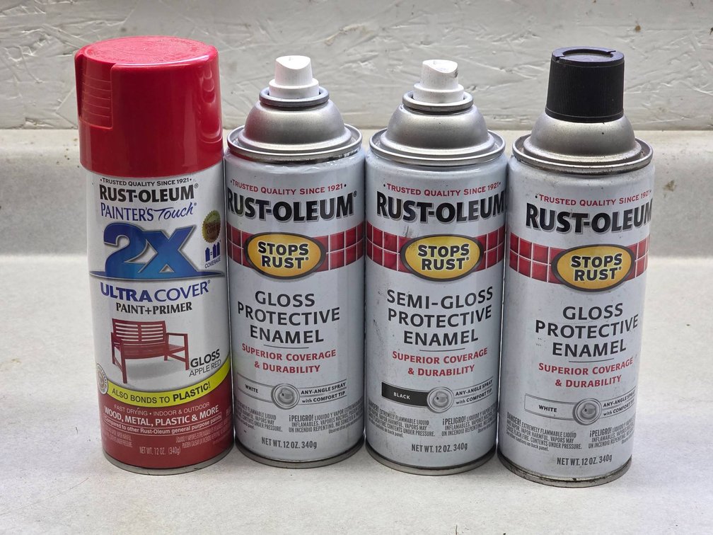 Four Cans of Rust-Oleum Spray Paint in White, Red, and Black Finishes