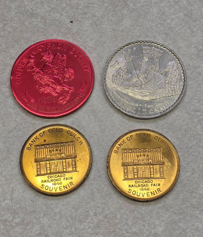 Four Commemorative Tokens Featuring Diverse Themes and Years