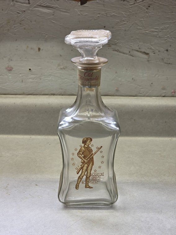 Antique Old Fitzgerald Bourbon Bottle with Soldier Depiction, 100 Proof