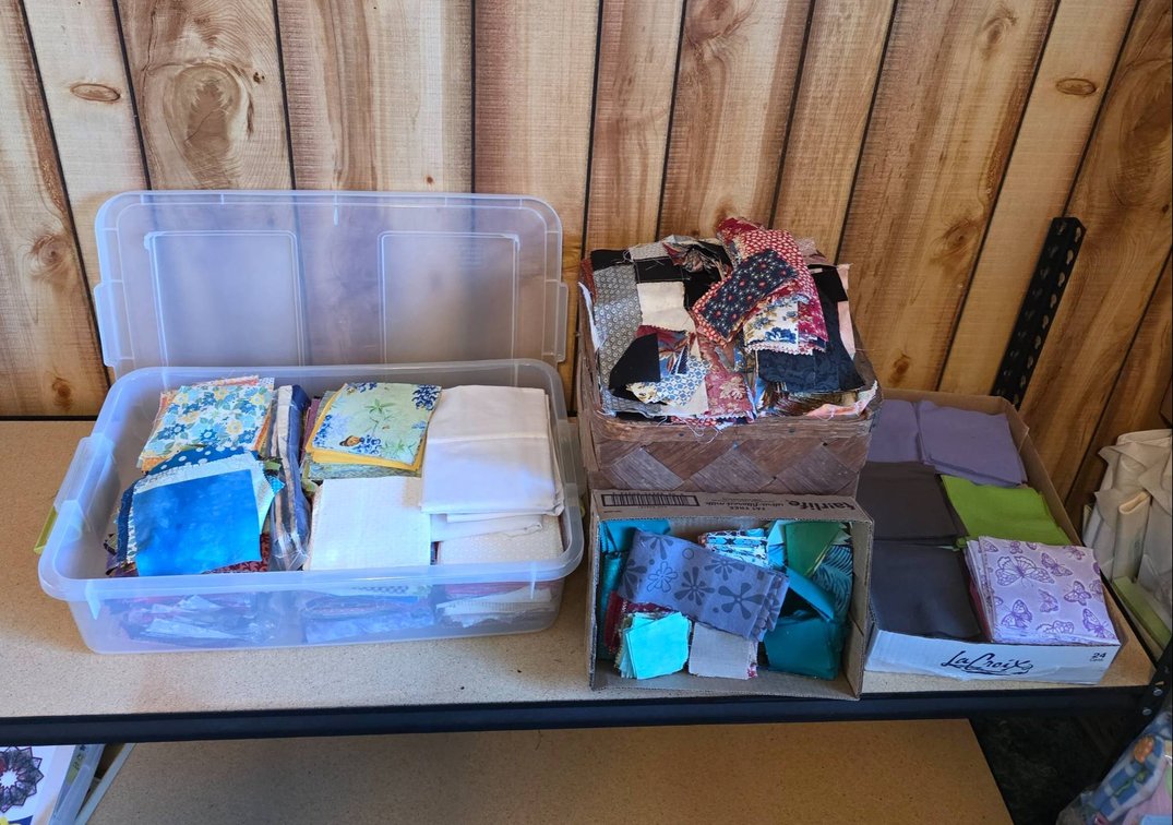 Quilting and Craft Fabric Scraps in Plastic Containers and Woven Baskets