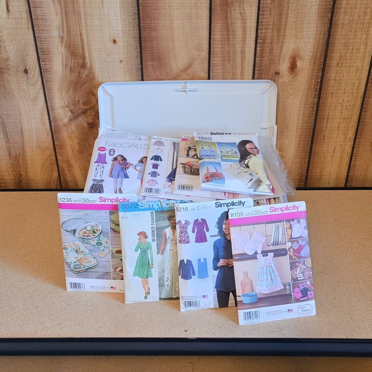 Sewing Patterns by Simplicity, McCall’s, and Butterick in Plastic Storage Bin