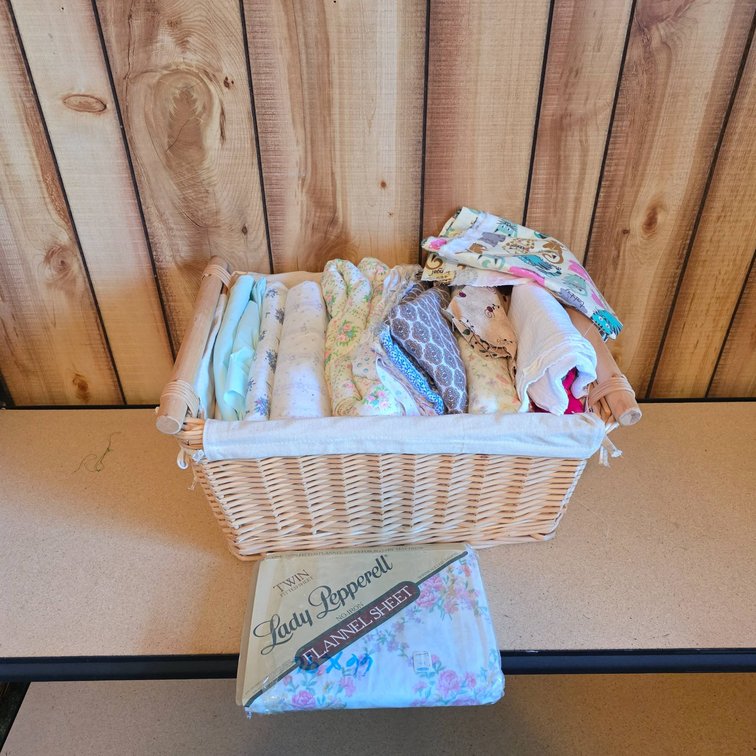 Woven Basket with Assorted Textiles and Fabric Swatches