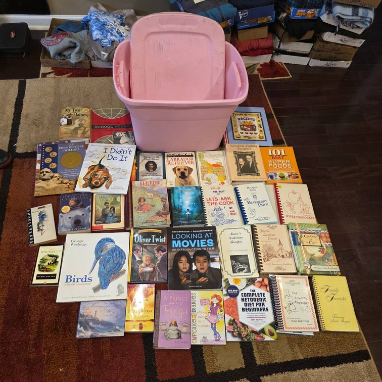About 35 Books with Pink Storage Bin