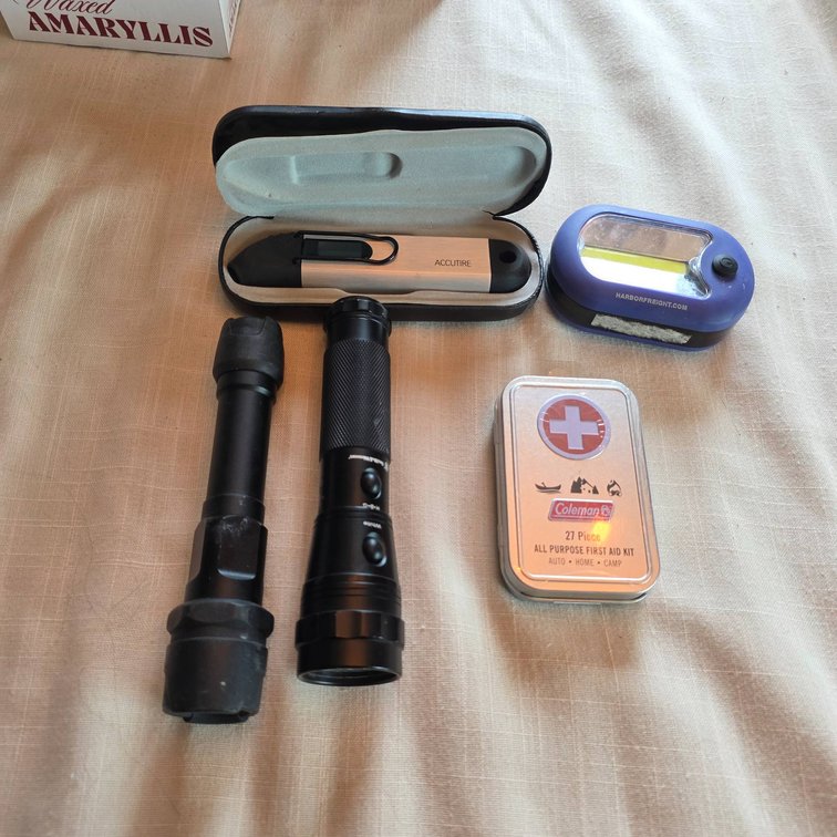 Flashlights, First Aid Kit, Accutire Digital Tire Gauge, and Clip-On LED Light