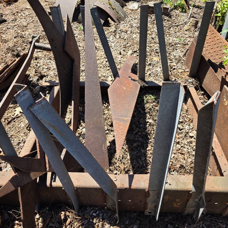 Flat Steel Chunks with Longest Piece Measuring Approximately 56 Inches