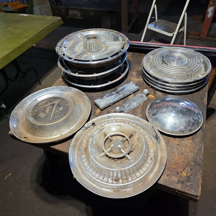 Vintage Hubcaps Including SS Super Sport and Ford Deluxe Models