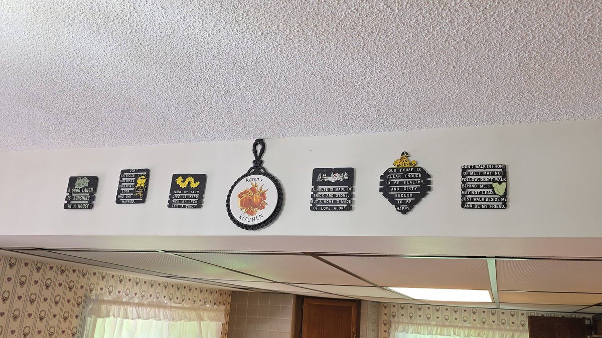 Seven Mid-Century Cast Aluminum Trivets with Silly Motto Designs