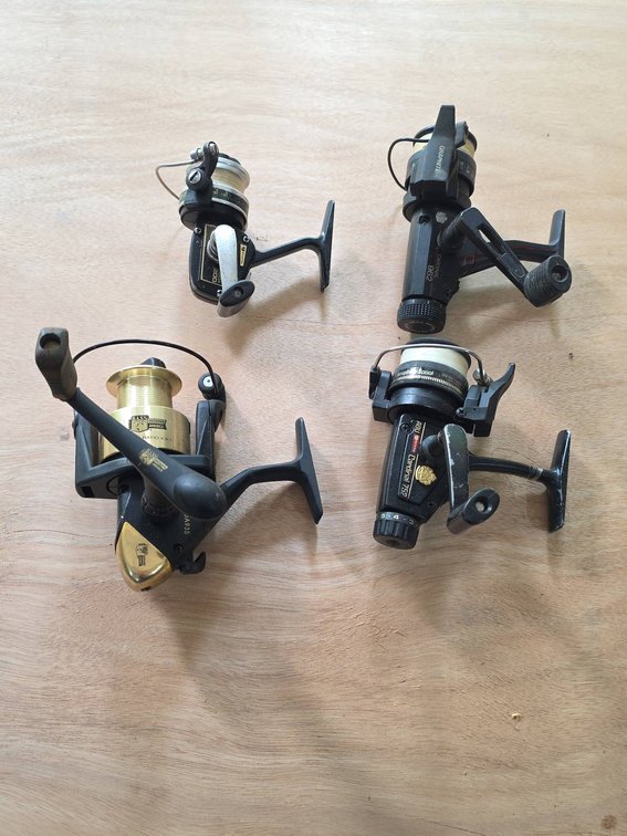 Four Fishing Reels Including ABU Garcia Cardinal and Bass Outdoor America