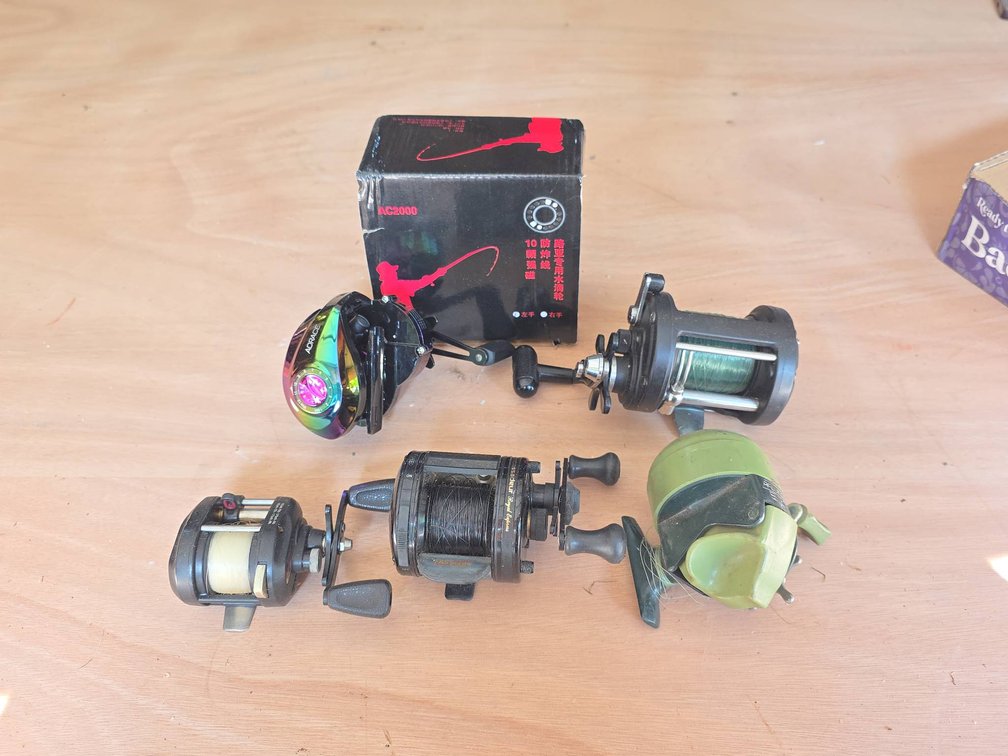 (5) Fishing Reels Including ABU Garcia, Pflueger, Shimano, and ADrace