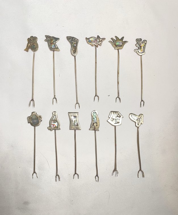 12 Silver and Abalone Skewers with Southwest Motifs Including Animals, Hands, and Symbols