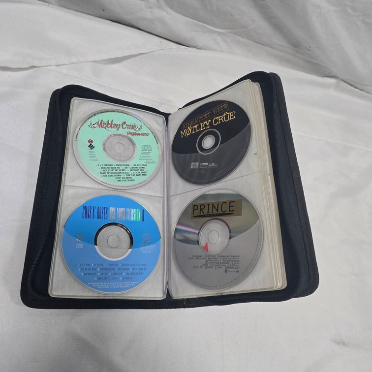 CD Collection in Case It Album: Mötley Crüe, Guns N' Roses, Prince, Janis Joplin, Pink Floyd, U2