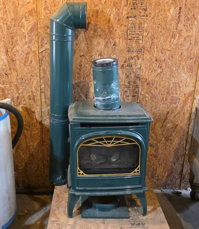 Aladdin Hearth DV425 NAT Green Enameled Cast Iron Gas Stove With Vent Pipe And Flame Control Panel