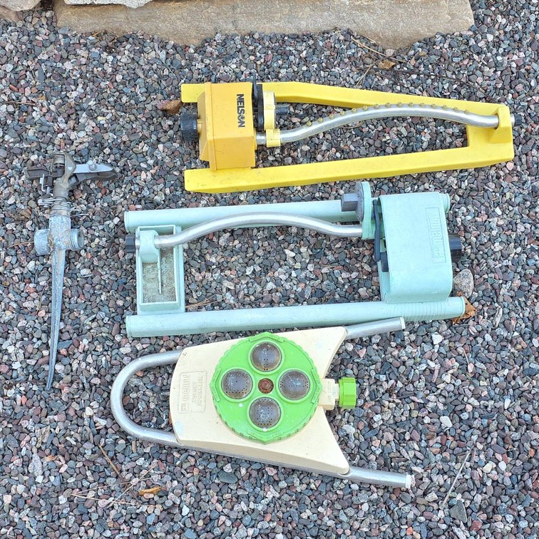 4 Metal Oscillating Lawn Sprinklers and 1 Impact Sprinkler, Brands Include Nelson, Melnor