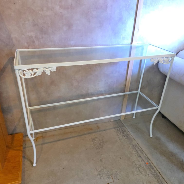 White Metal Frame Console Table with Two Glass Shelves and Decorative Leaf Accents