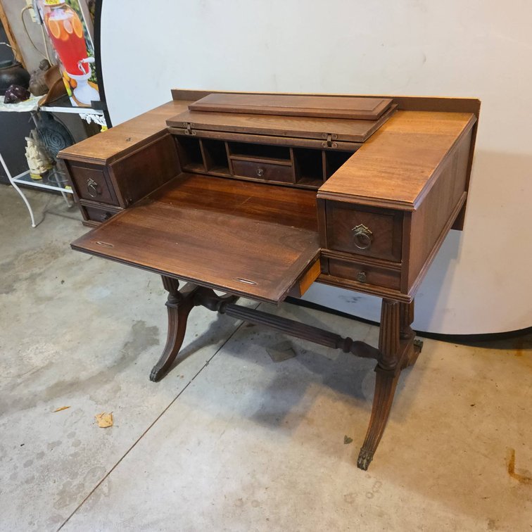 Wooden Spinet Desk with Multiple Drawers and Added Decorative Carved Back Panel