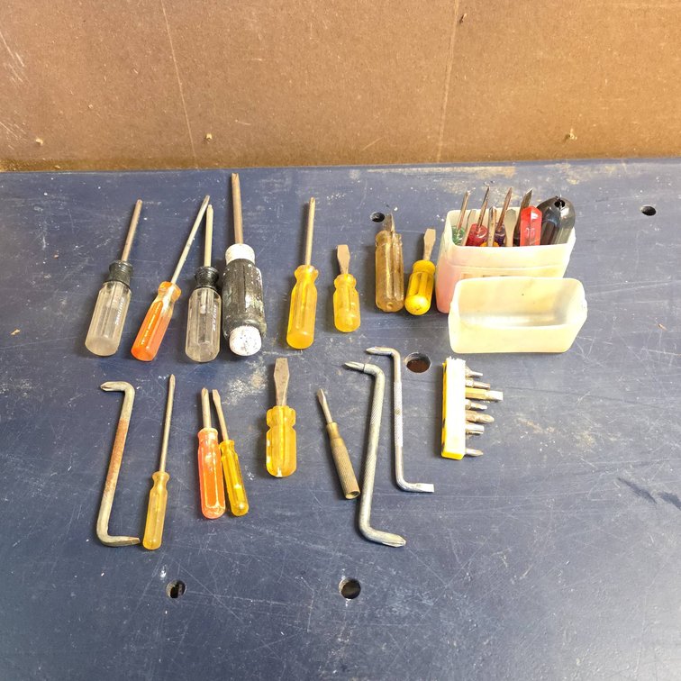 25 Mixed Screwdrivers, Pry Bars, Bits, and Small Hand Tools With Storage Case