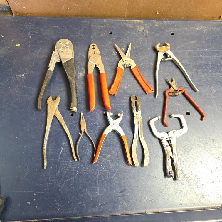 Ten Hand Tools Including Pliers, Wire Cutters, Strippers, Shears, and Clamp