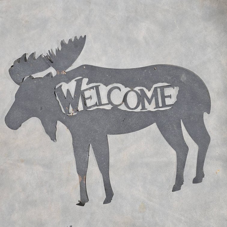 Metal Moose-Shaped Welcome Sign With Cutout Lettering, Slightly Bent Corners, And Velcro Attachments