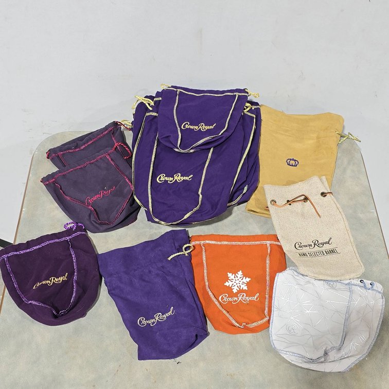 Approximately 28 Crown Royal Bags, Various Sizes and Materials, Large and Small Varieties
