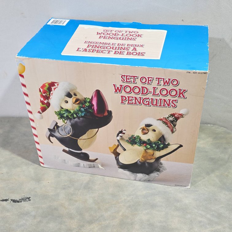 Two Wood-Look Holiday Penguin Figures Sealed in Box with Santa Hats and Decorations
