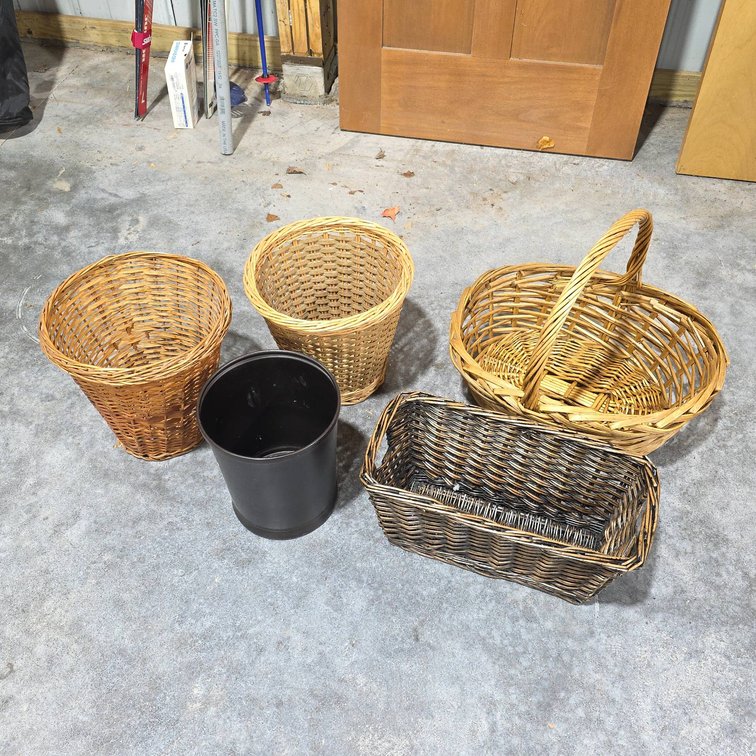 Basket Lot: Two Wicker Waste Baskets, One Black Wastebasket, Rectangular Basket with Handles, Oval Basket