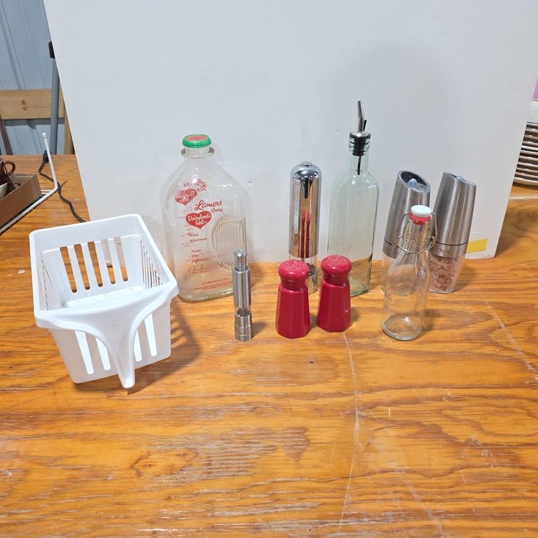 Kitchen Items Including Milk Bottle, Automatic Pepper Grinders, Oil Dispenser, and Locking Glass Bottle