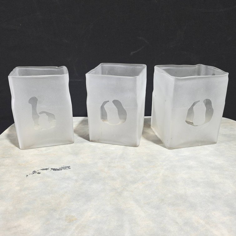 Three Frosted Glass Candle Containers With Cutout Letters Spelling "BOO"