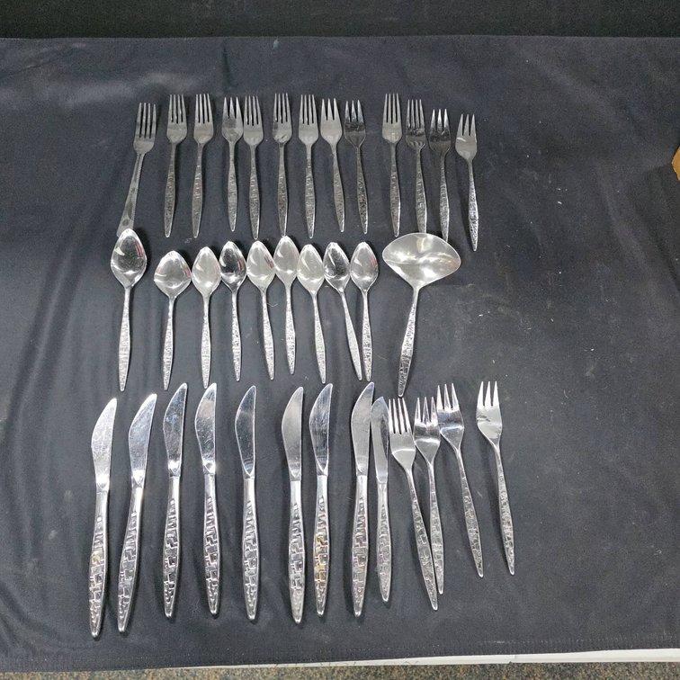 36 Eton Stainless Flatware Pieces with Geometric Handles and Serving Utensils