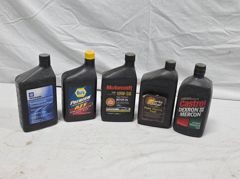 Partial Automotive Fluid Jugs: GM Synchromesh, NAPA ATF, Motorcraft Oil, Parts Master, etc