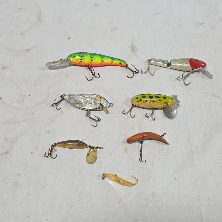 7 Fishing Lures Including Metal and Colorful Hard Bait