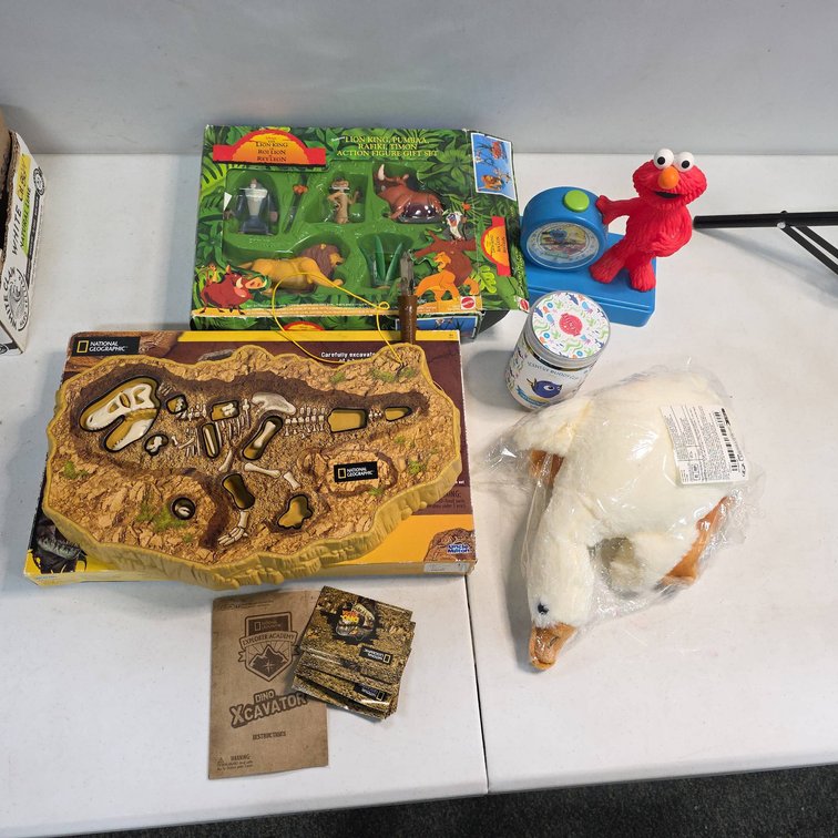 Lot: Lion King Action Figures, Elmo Clock, Disney Scentsy Buddy Clip, Plush Goose, Dino Xcavator