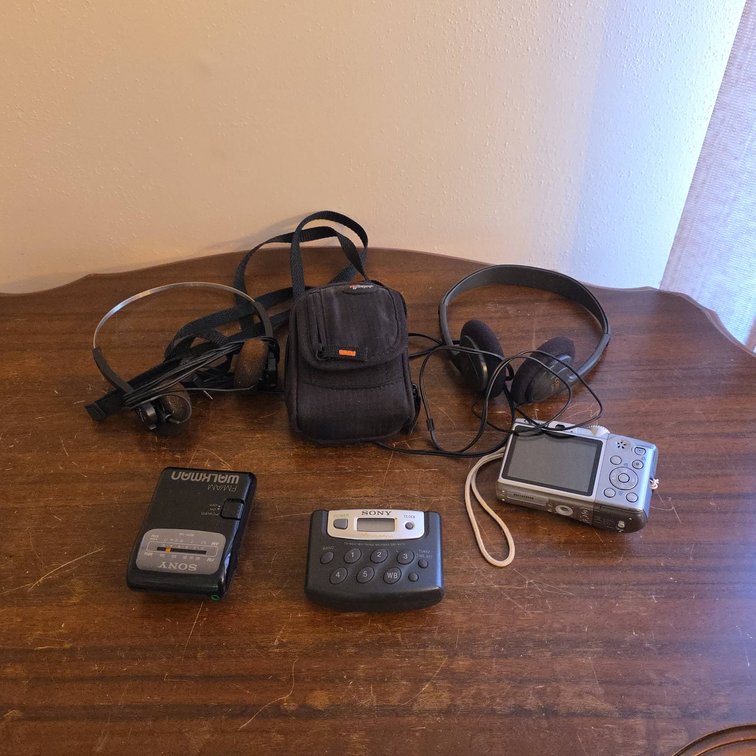 Sony SRF-39 Walkman, Sony SRF-M37W, Canon PowerShot A1200, and 2 Headphones
