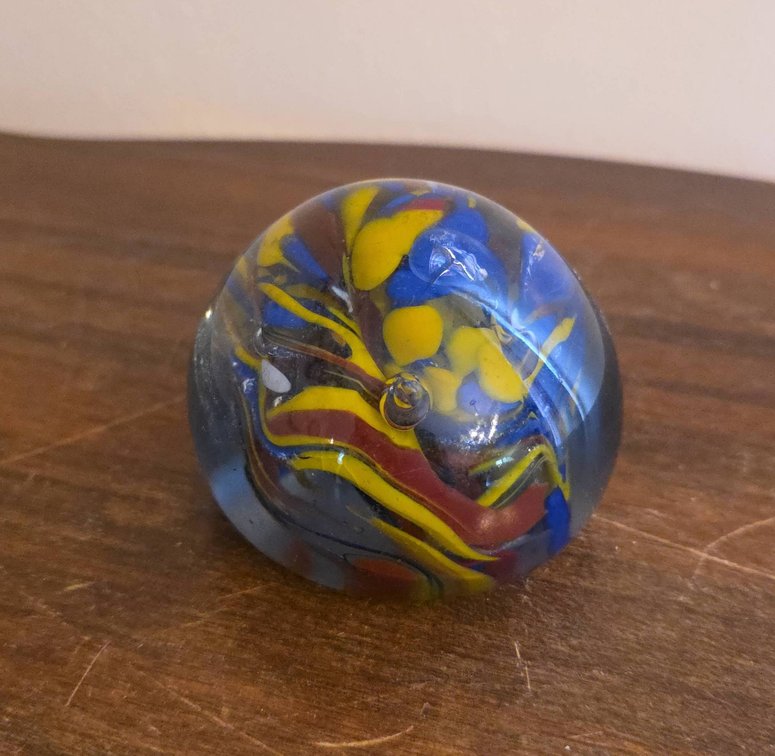 Handmade Multicolor Glass Paperweight With Swirled Yellow, Blue, and Red Design