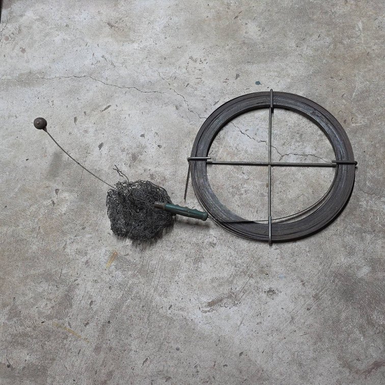 Metal Drain Snake with Mesh Head and Green Handle, Coiled Plumbing Tool