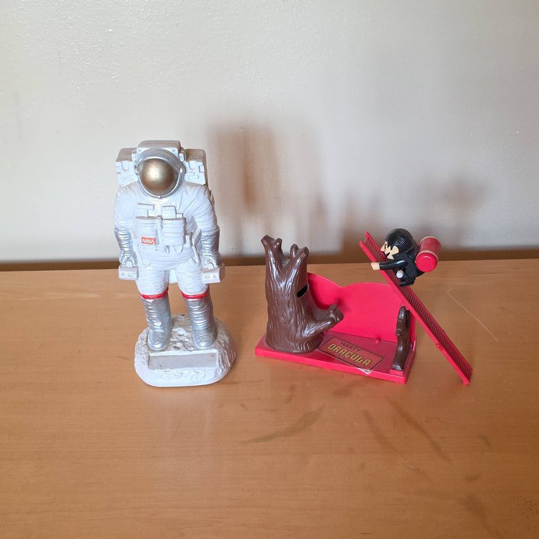 NASA Astronaut Charles Products Coin Bank and Hasty Dracula Wind-Up Coin Bank, Lot of 2