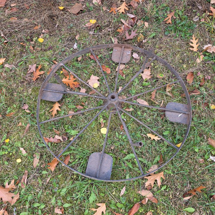 Steel Spoked Wheel With Paddles, Likely For Vintage Farm Implement Or Agricultural Equipment