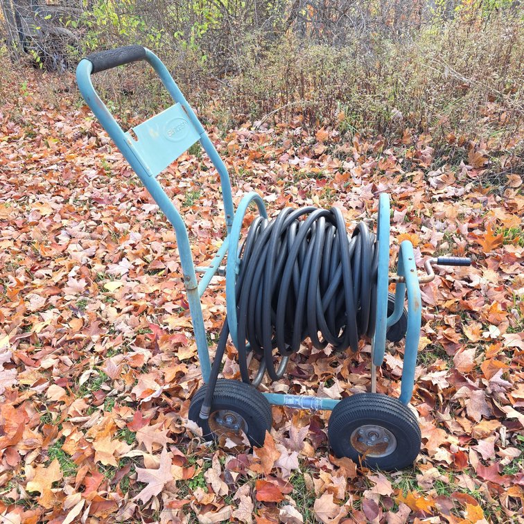 Suncast Metal Garden Hose Reel Cart with Black Rubber Hose and Four Wheels