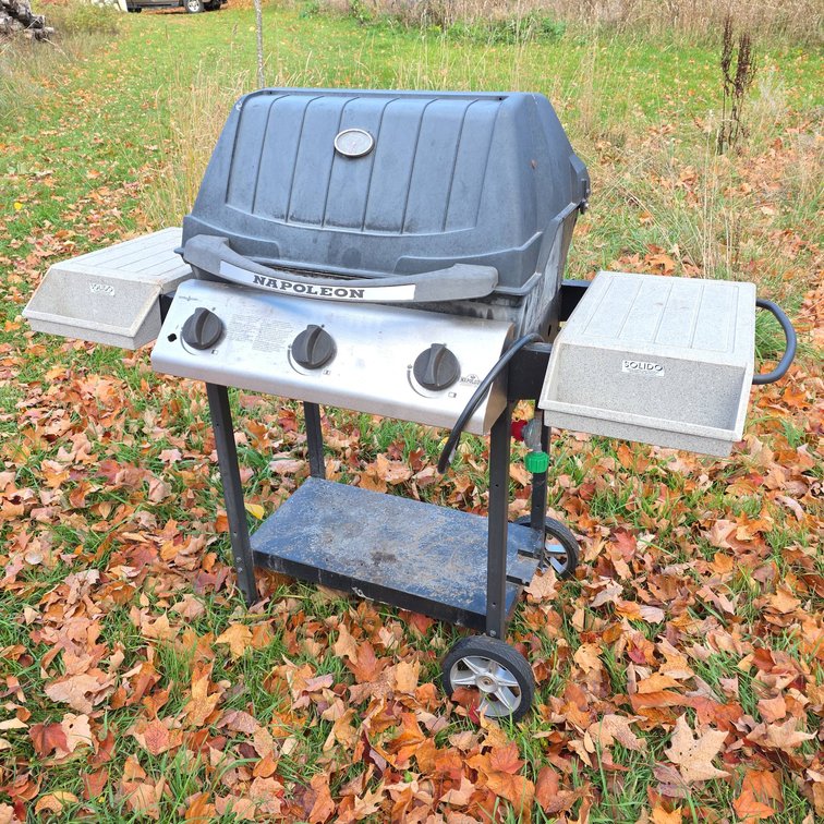 Napoleon Propane Gas Grill with Three Burners, Side Shelves, and Lower Storage Shelf