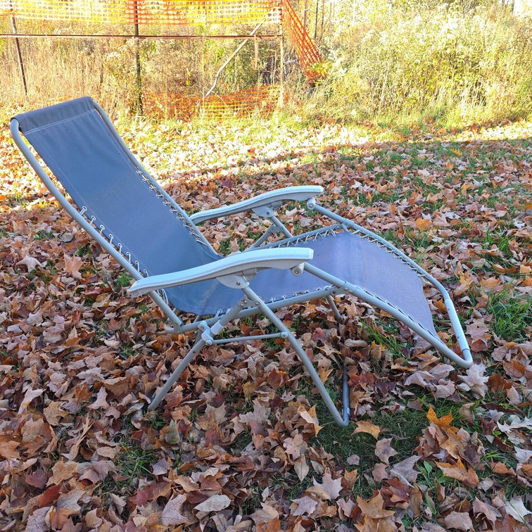 Gray Mesh Reclining Outdoor Lounge Chair With White Metal Frame And Plastic Armrests